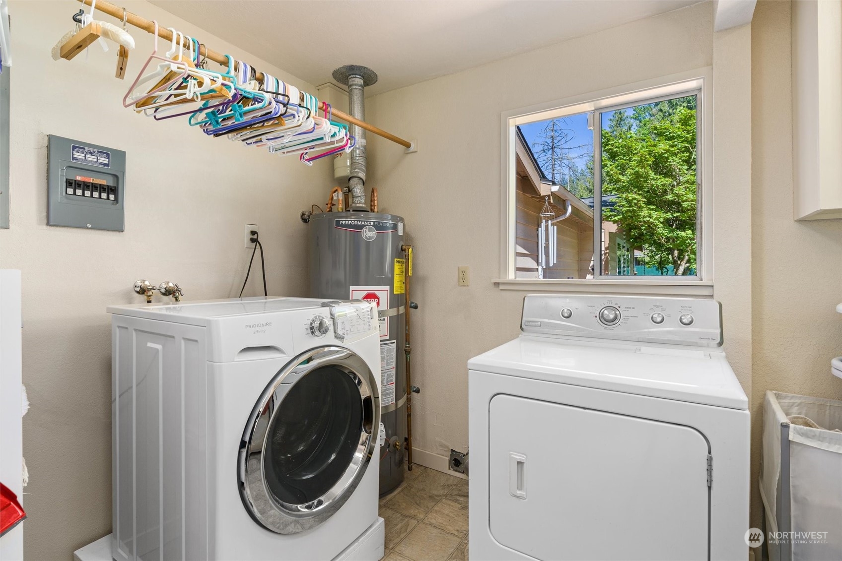 19804 Southeast 150th Street Renton, WA 98059 - Photo 32 of 40 a view of a utility room with dryer and washer