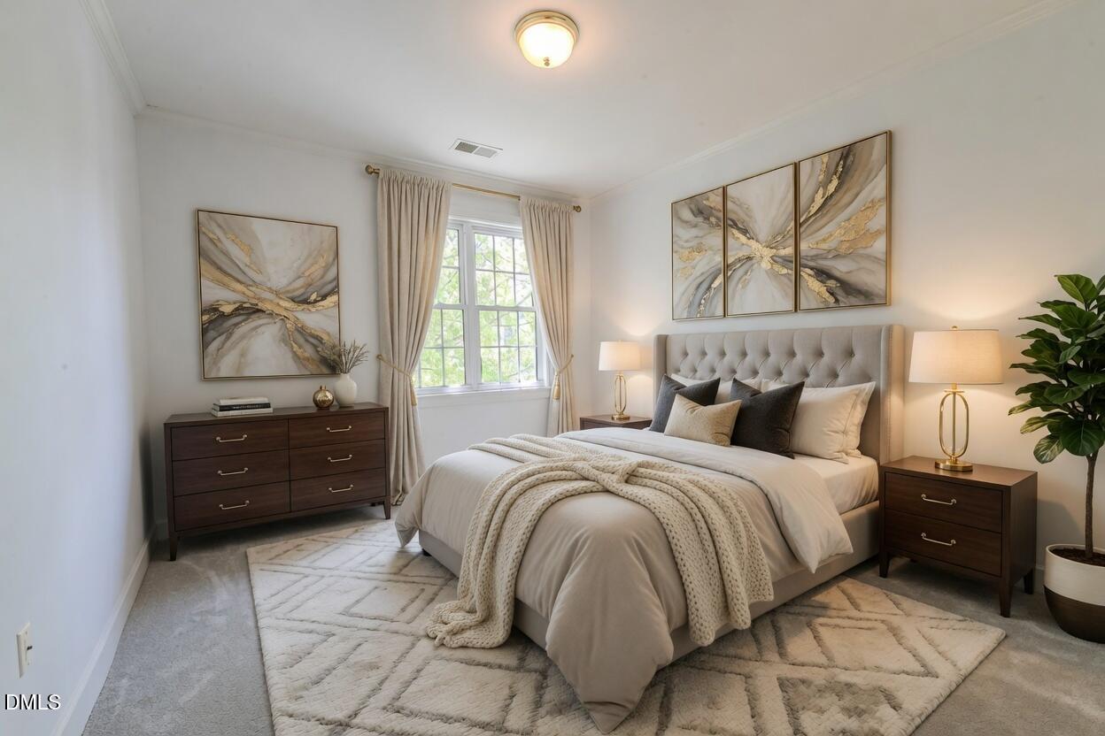 116 Northbrook Drive, Unit 305 Raleigh, NC 27609 - Photo 9 of 43 a bedroom with a bed and a painting on the wall