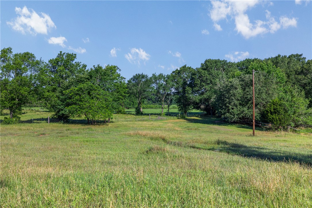 871 Cazey Loop Franklin, TX 77856 - Photo 38 of 42 a view of outdoor space with deck and yard