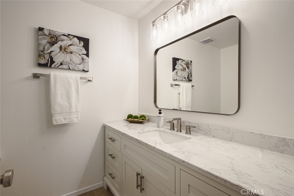 26941 Rainbow Glen Drive, Unit 751 Santa Clarita, CA 91351 - Photo 14 of 34 a bathroom with a sink vanity and a mirror