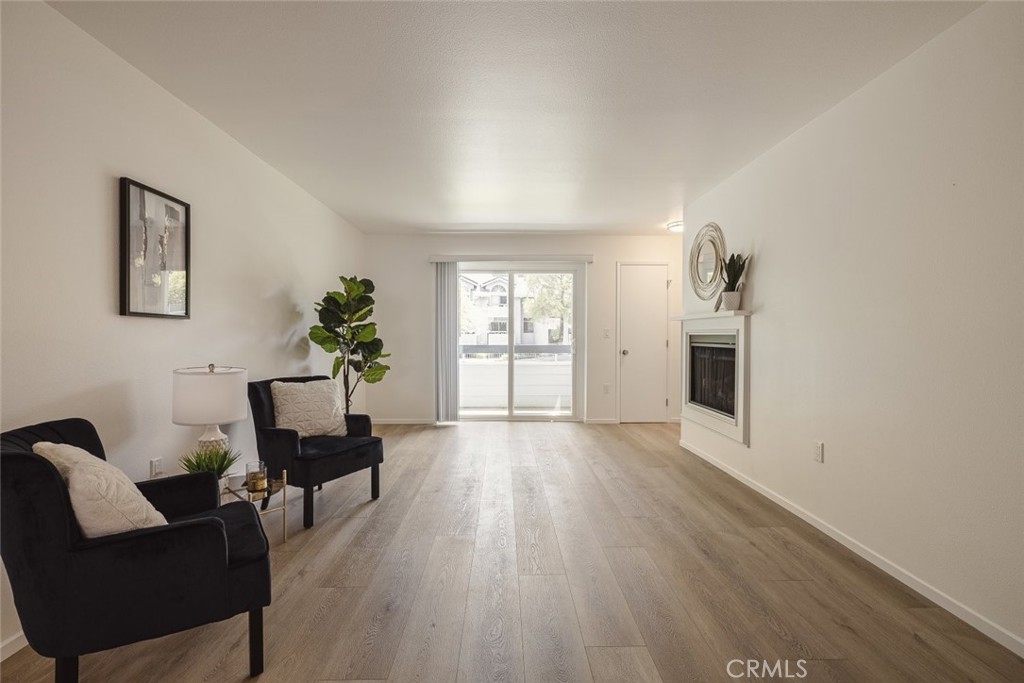 26941 Rainbow Glen Drive, Unit 751 Santa Clarita, CA 91351 - Photo 15 of 34 a view of a livingroom with furniture and wooden floor