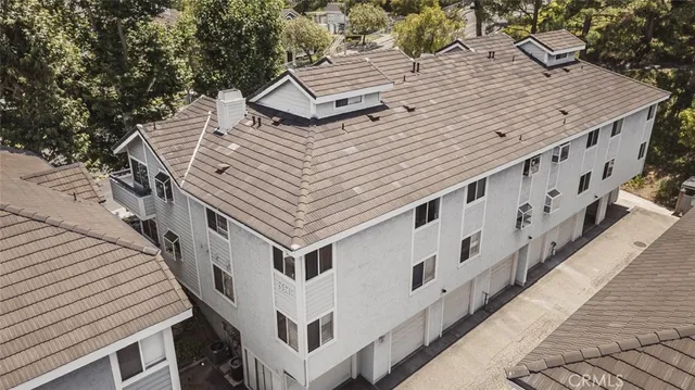 a roof deck with table and chairs