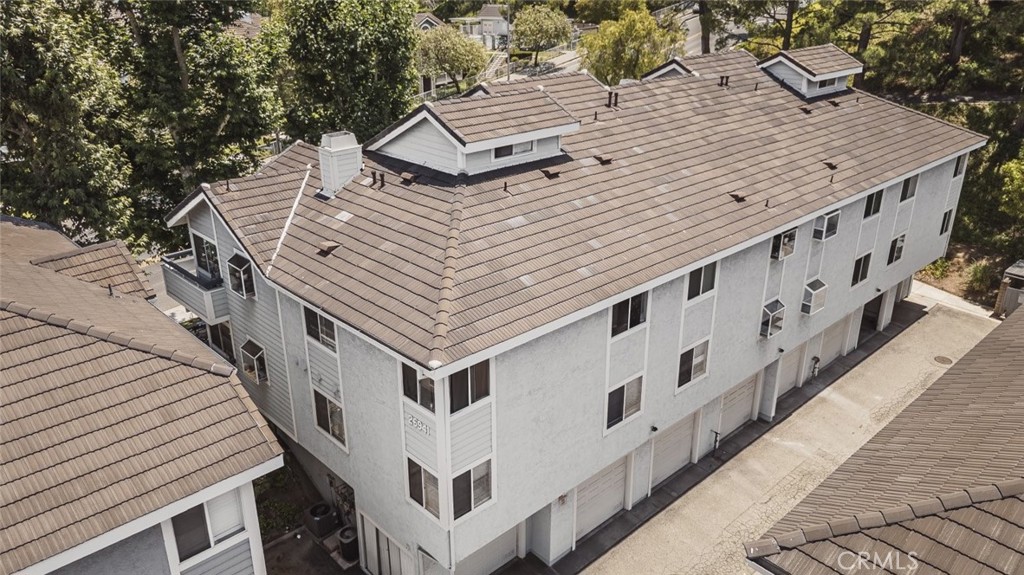 26941 Rainbow Glen Drive, Unit 751 Santa Clarita, CA 91351 - Photo 30 of 34 a roof deck with table and chairs