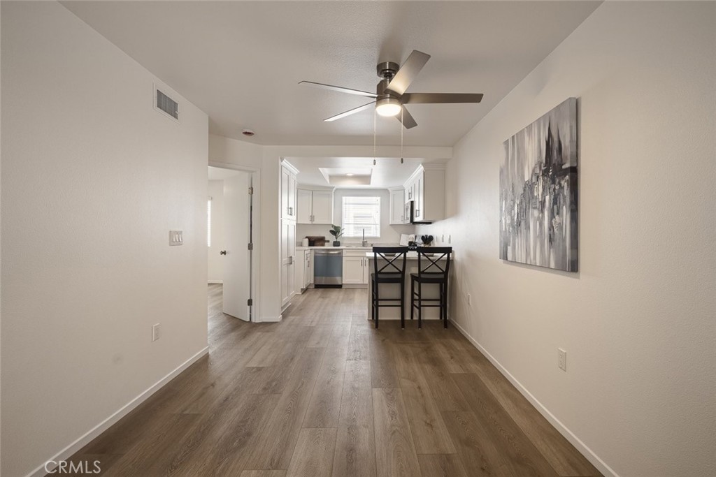 26941 Rainbow Glen Drive, Unit 751 Santa Clarita, CA 91351 - Photo 3 of 34 a view of a room with wooden floor and furniture