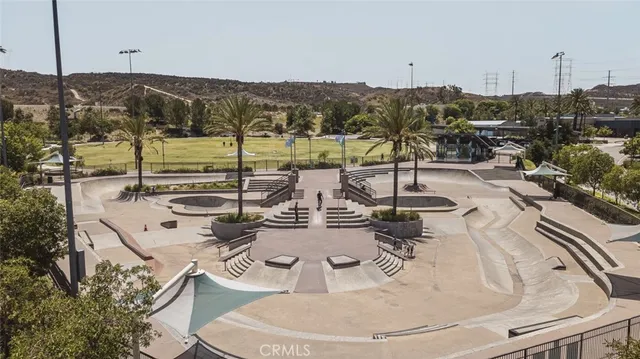 a view of a swimming pool with a table and chairs