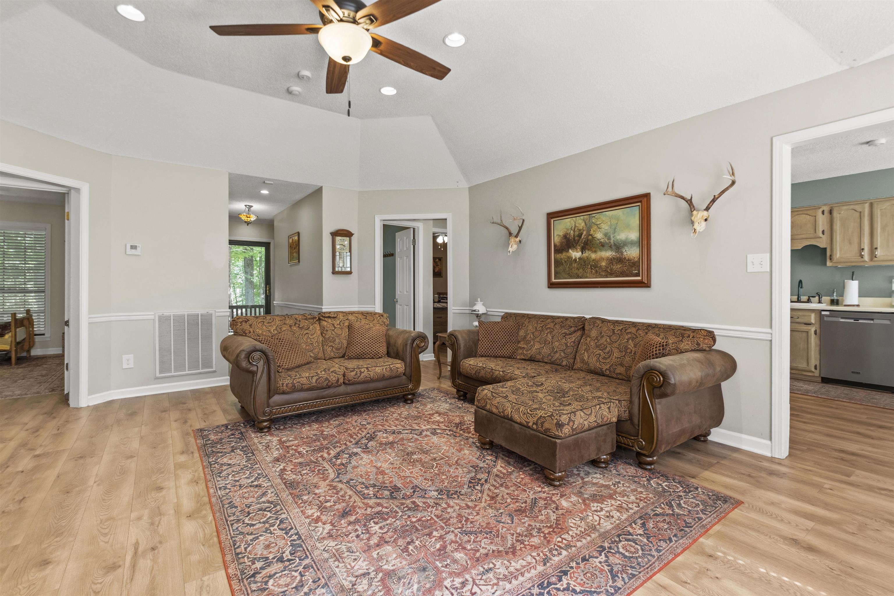 3601 Marshall Road Munford, TN 38058 - Photo 15 of 35 Spacious living area featuring light wood-finish flooring, vaulted ceilings with a ceiling fan, and recessed lighting