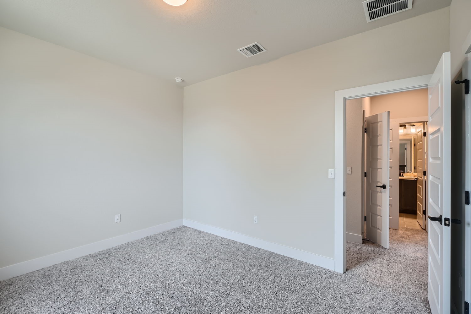 8319 Laughlin Lane Austin, TX 78744 - Photo 21 of 26 Secondary bedroom located on the upper floor.