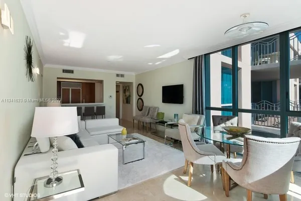 a living room with furniture and a flat screen tv