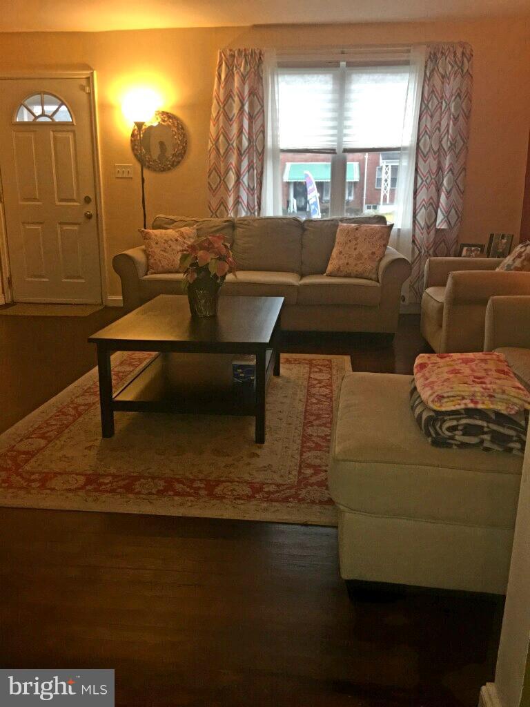 1728 Ingram Road Baltimore, MD 21239 - Photo 14 of 44 a living room with furniture and a window