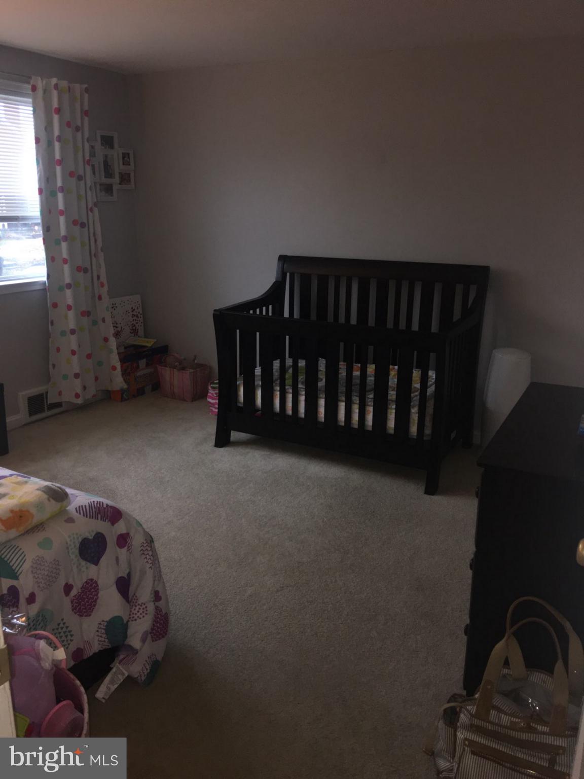 1728 Ingram Road Baltimore, MD 21239 - Photo 18 of 44 a bedroom with a bed and a window