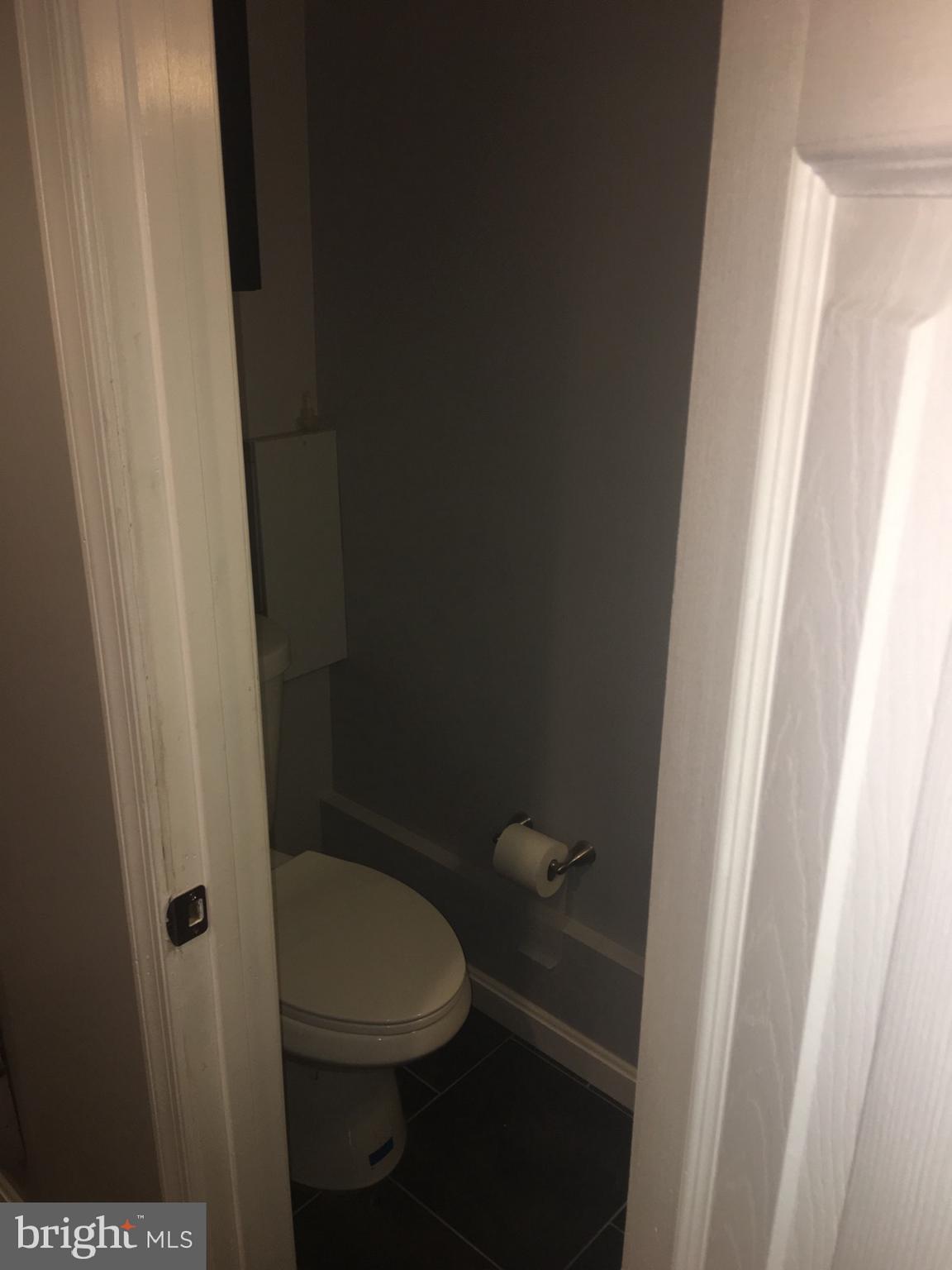 1728 Ingram Road Baltimore, MD 21239 - Photo 32 of 44 a bathroom with a toilet and a sink