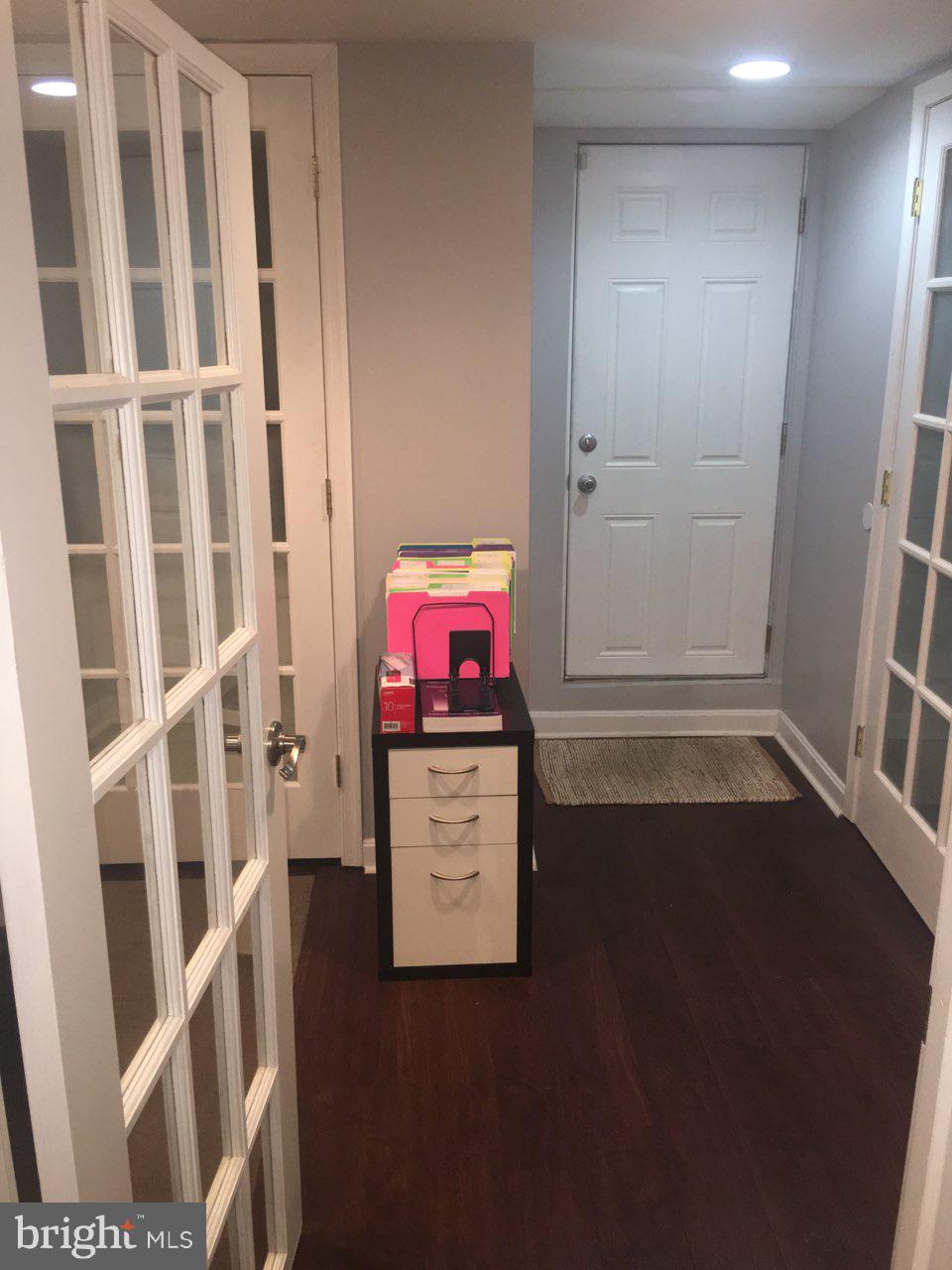 1728 Ingram Road Baltimore, MD 21239 - Photo 36 of 44 an empty room with furniture and wooden floor