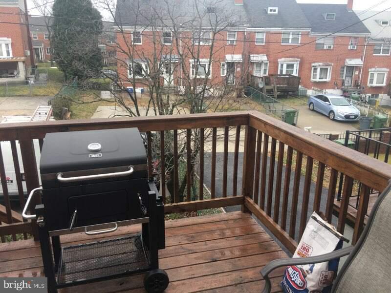 1728 Ingram Road Baltimore, MD 21239 - Photo 40 of 44 a view of a balcony with wooden floor
