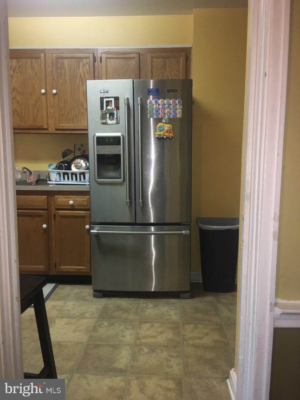 1728 Ingram Road Baltimore, MD 21239 - Photo 10 of 44 a kitchen with granite countertop a stove and a refrigerator