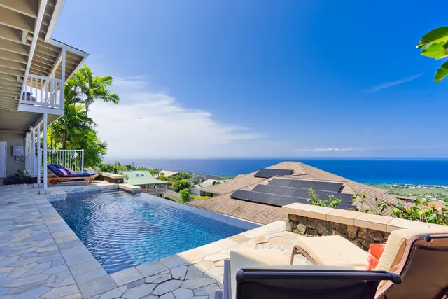 a view of a balcony with chairs