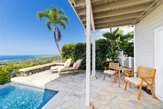 a view of a chairs and table in a patio