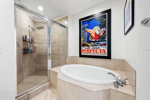 a bedroom with a bed and a flat tv screen