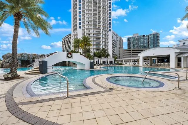 a outdoor living space with furniture and a fireplace