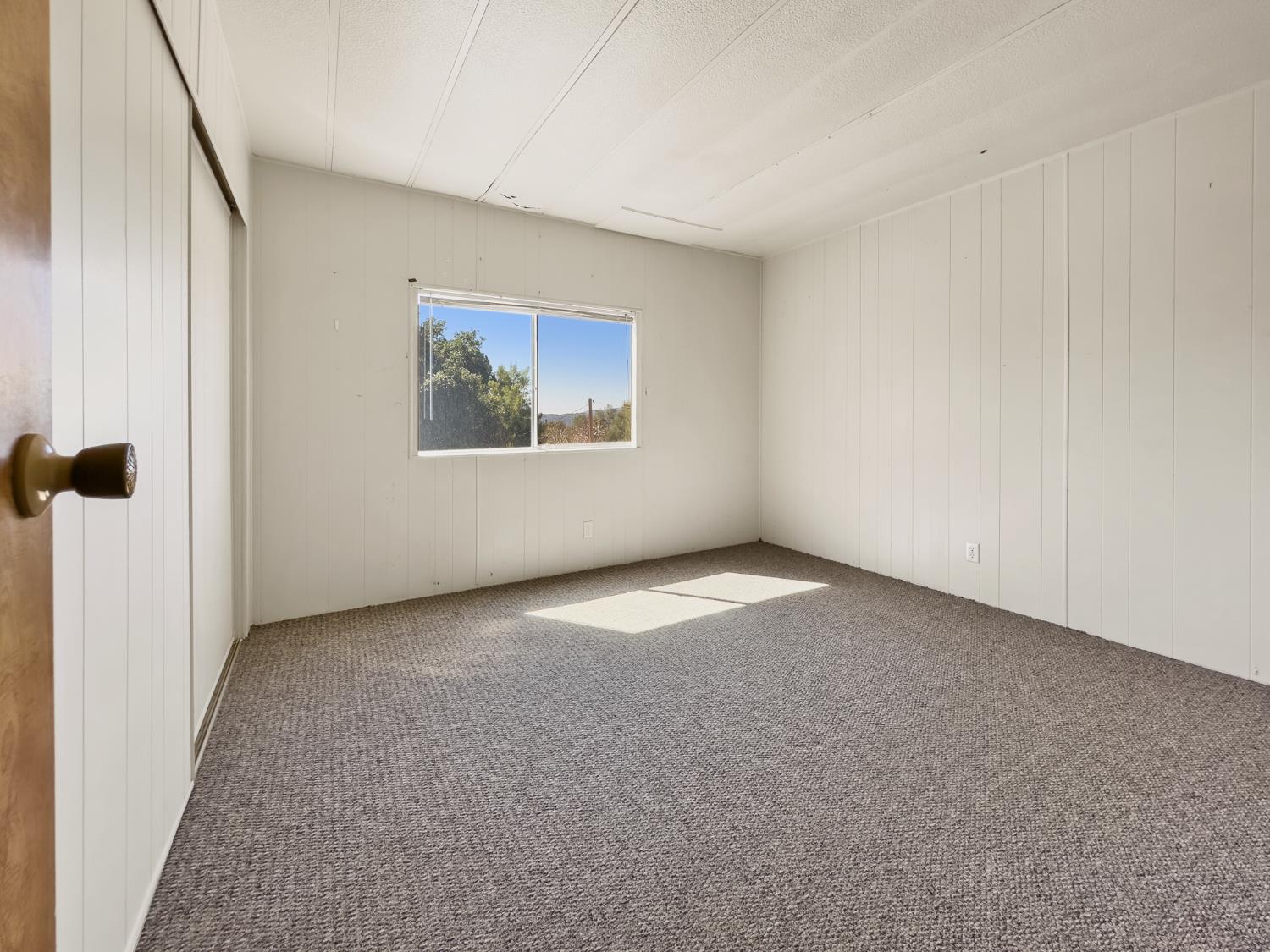 40882 Jean Road East Oakhurst, CA 93644 - Photo 26 of 32 a view of an empty room with a window