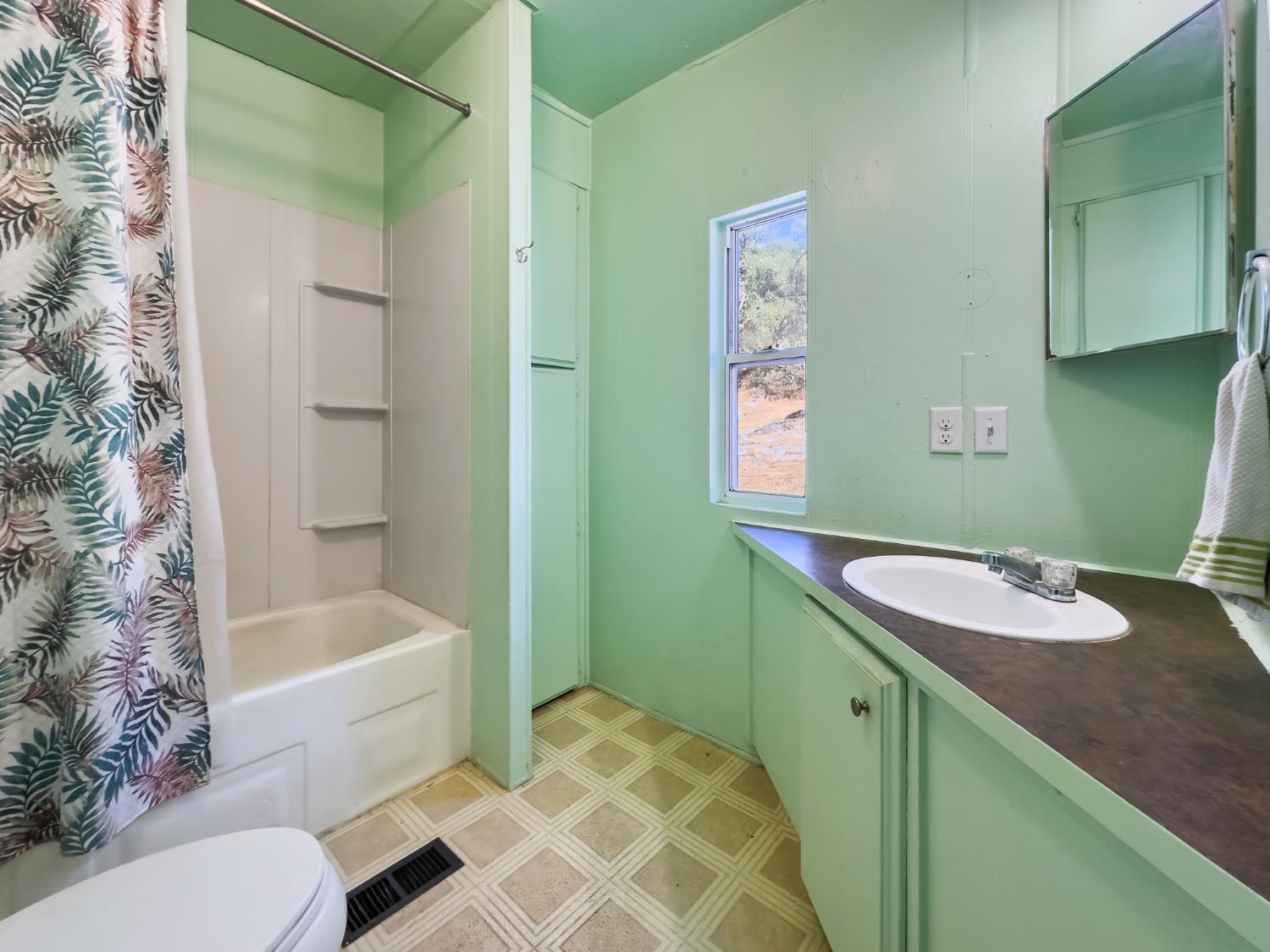 40882 Jean Road East Oakhurst, CA 93644 - Photo 28 of 32 a bathroom with a sink and a mirror