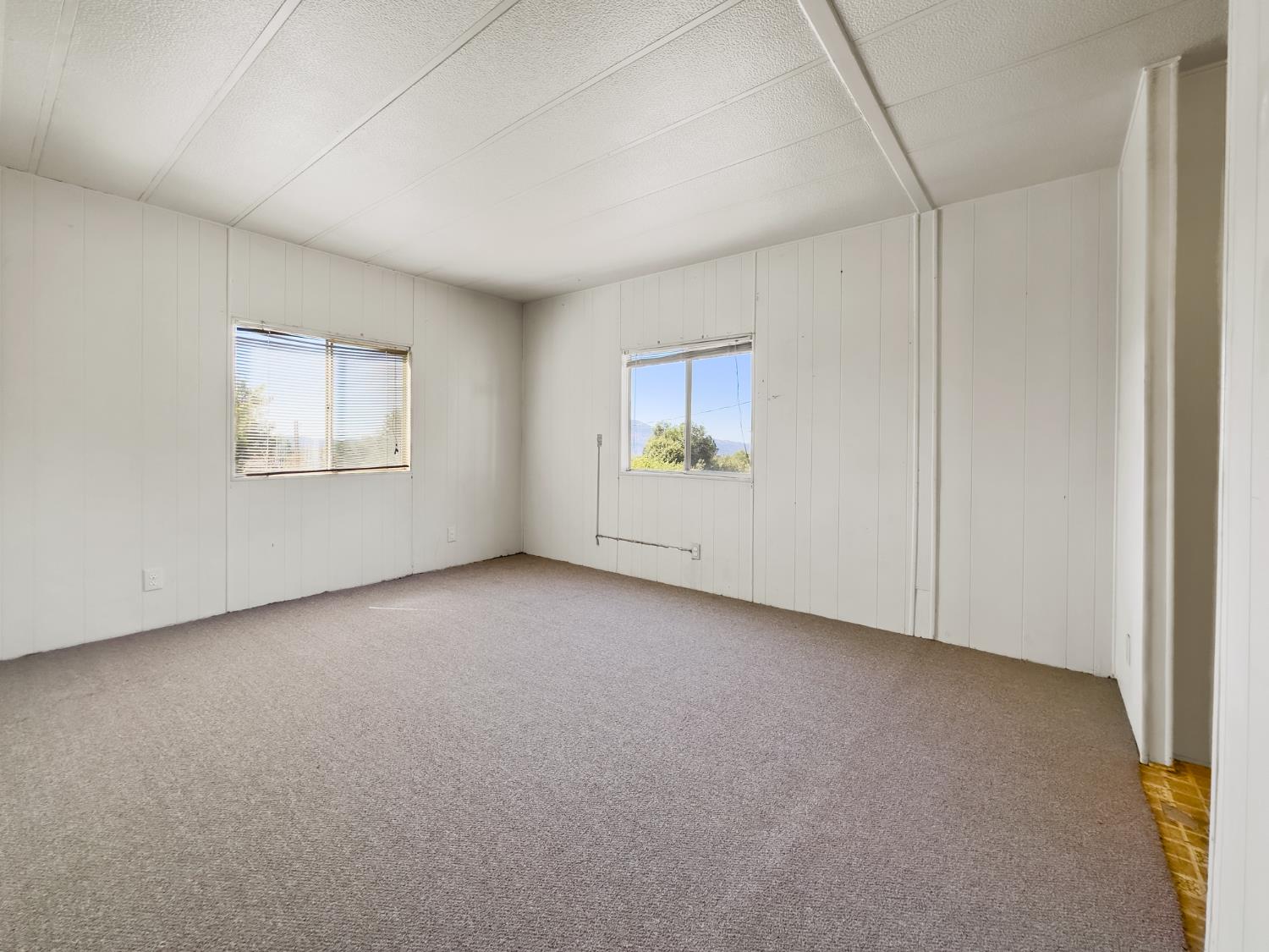 40882 Jean Road East Oakhurst, CA 93644 - Photo 30 of 32 an empty room with windows