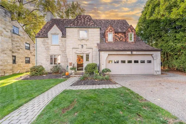 a view of a front of a house with a yard