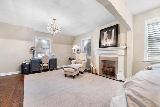 a bed room with furniture and a fireplace