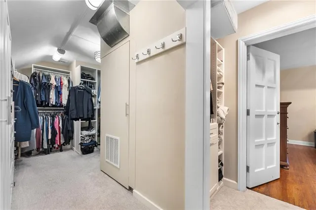 a bathroom with a granite countertop sink a toilet and shower