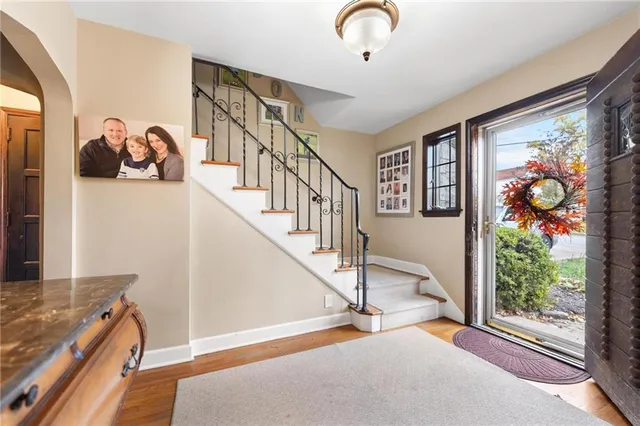 a view of an entryway with wooden floor