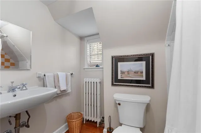 a bedroom with furniture and a fireplace