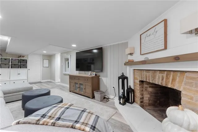 a living room with furniture and view of kitchen