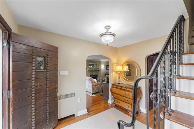 a view of a livingroom with furniture and hardwood floor