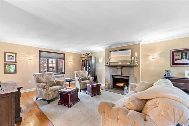 a living room with furniture fireplace and a flat screen tv