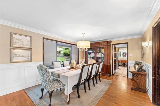 a view of a dining room with furniture window and wooden floor