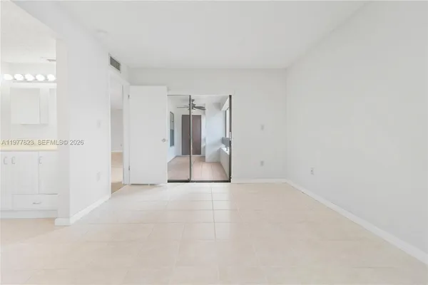 a bathroom with a shower sink and mirror
