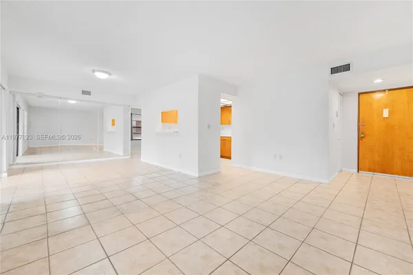 a view of an empty room and window