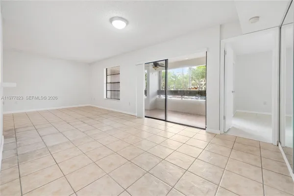 a view of an empty room and window