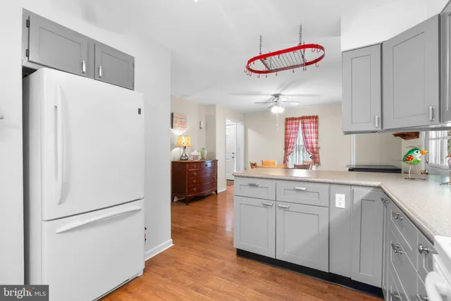 a kitchen with a refrigerator a sink dishwasher and a refrigerator