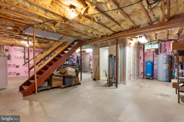 a view of an empty room with stairs