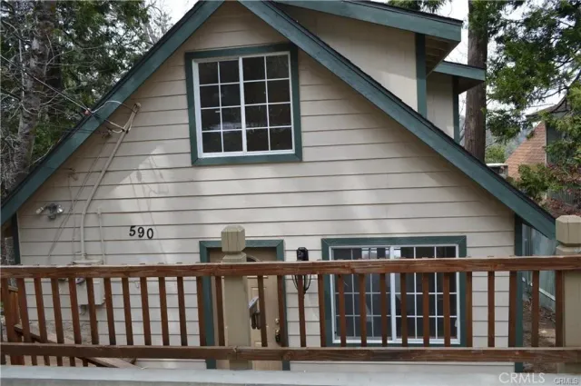 a front view of a house with deck