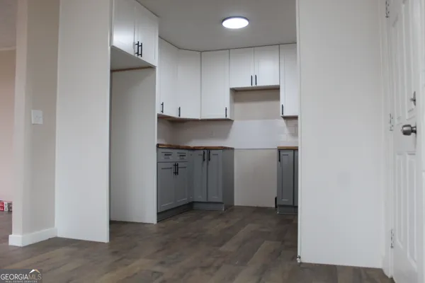 a view of a kitchen with a sink and dishwasher refrigerator freezer