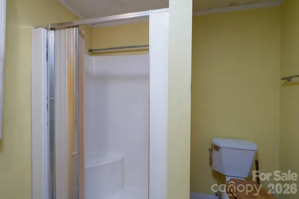 a bathroom with a shower and a sink