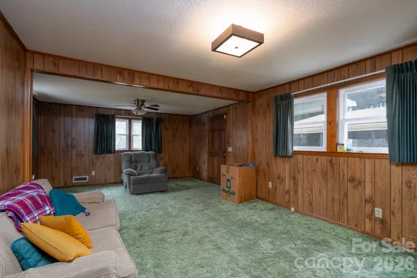 a living room with furniture and a window