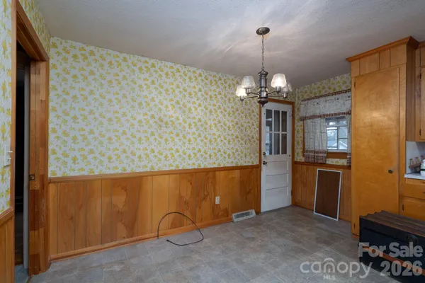 a view of a refrigerator and cabinets