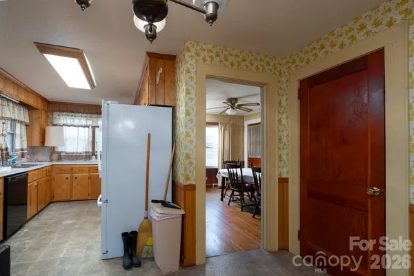 a kitchen with lots of counter top space and stainless steel appliances
