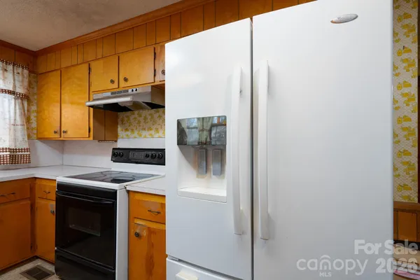 a kitchen with a sink and a window