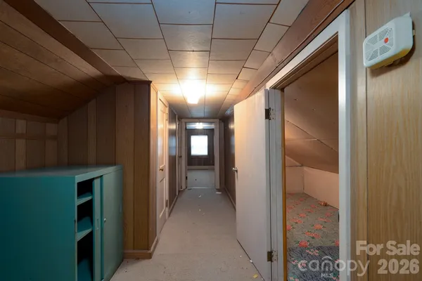 a view of a house with a yard covered in snow