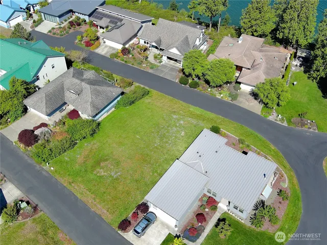 an aerial view of a house a garden and swimming pool