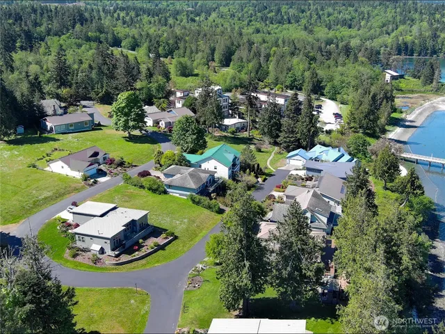 an aerial view of a house with yard swimming pool and outdoor seating
