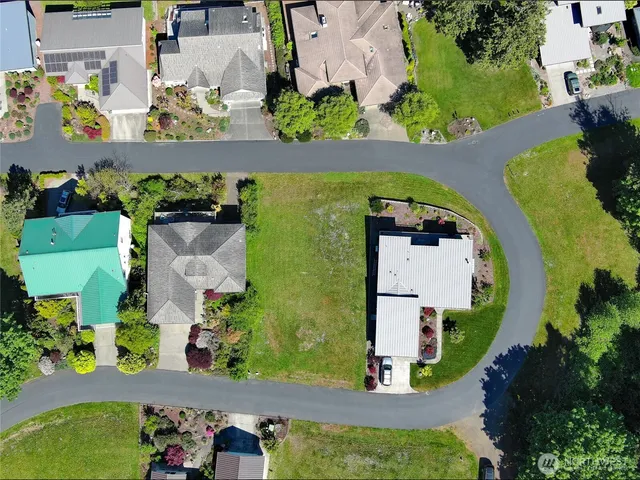 an aerial view of a house with a garden